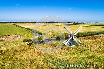 Little windmill on the island Texel Stock Photo