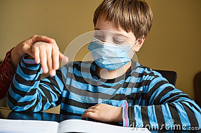 Boy doing homework Stock Photo