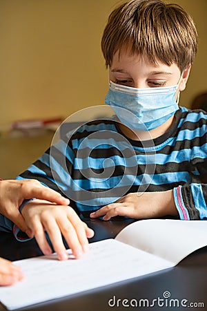 Boy doing homework Stock Photo