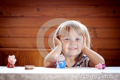 Little girl with her toys Stock Photo