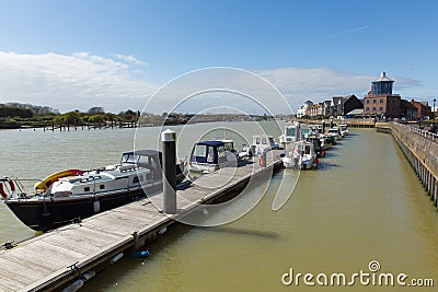 Littlehampton harbour with boats moored by the jetty Stock Photo