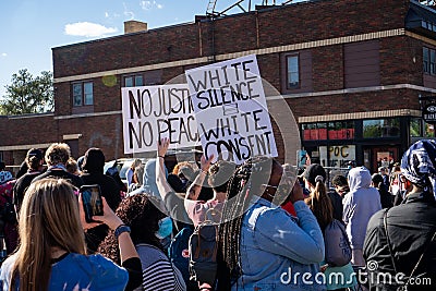 Live demonstrators and protestors holding signs in the streets at the minneapolis riots for george floyd Editorial Stock Photo