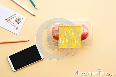 Live healthy concepts with text note and red apple in packaging on desk worktable background Stock Photo