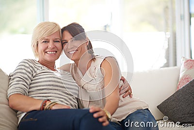 We live a a life of love. Portrait of a lesbian couple relaxing at home. Stock Photo