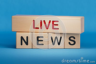Live News symbol. Wooden blocks with words 'Live News'. Stock Photo