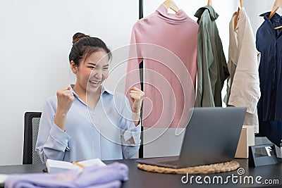 Live shopping concept a female seller feeling delighted to her success after the sale reaching the goal Stock Photo