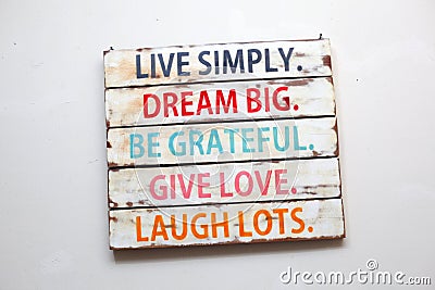 Live Simply, Dream Big, Be Grateful, Give Love, Laugh Lots. Motivational words Stock Photo