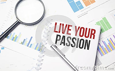 LIVE YOUR PASSION words on labels with document binders Stock Photo