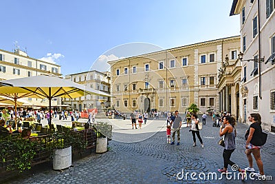 The Piazza Santa Maria in Trastevere in Rome Italy as tourists and locals enjoy the cafes and fountain outside the cathedral. Editorial Stock Photo