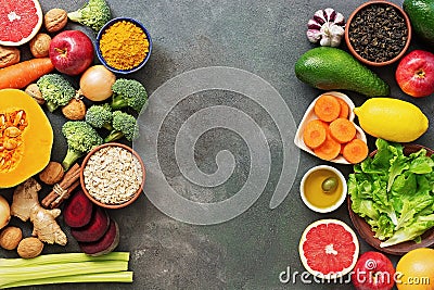 Liver detox diet food concept, fruits, vegetables, nuts, olive oil, garlic. Cleansing the body, healthy eating. Top view, flat lay Stock Photo