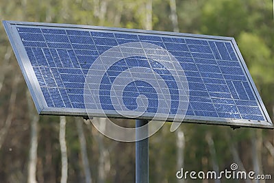 Livestock water tank, which uses solar panels to pump the water out of the ground Stock Photo