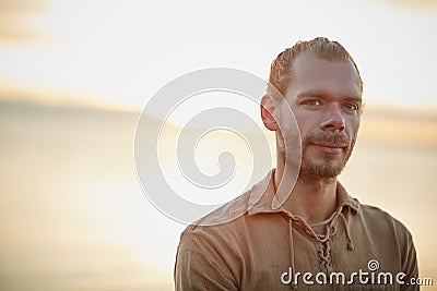 Living life without four walls. Portrait of a man spending a relaxing day at the beach. Stock Photo