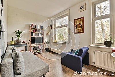 a living room with a couch and a chair and Editorial Stock Photo