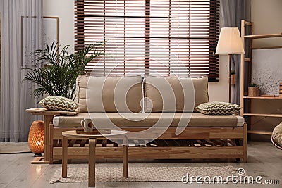 Living room interior with sofa, window blinds and decor elements Stock Photo