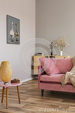 Living room in neutral colors with accents of pink and wood Stock Photo