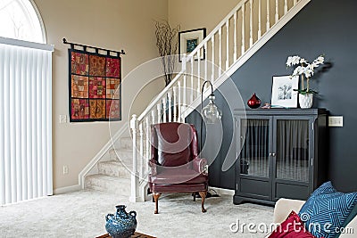 Living Room Staircase with Black Accent Wall Editorial Stock Photo