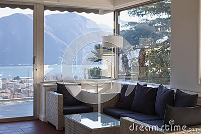 Living room with window overlooking the lake Stock Photo