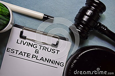 Living trust and Estate Planning text on Document form and Gavel on office desk. Stock Photo