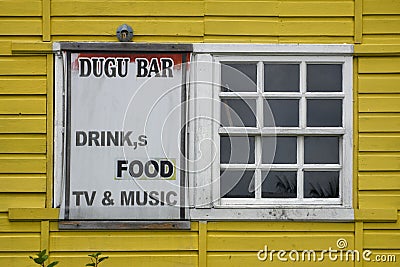 Livingston, Caribbean, Guatemala: sign with funny plural - Drink,s Editorial Stock Photo