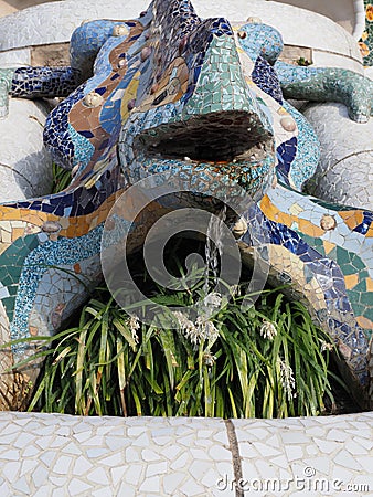 Lizard fountain at park Guell in Barcelona city in Spain - vertical Stock Photo
