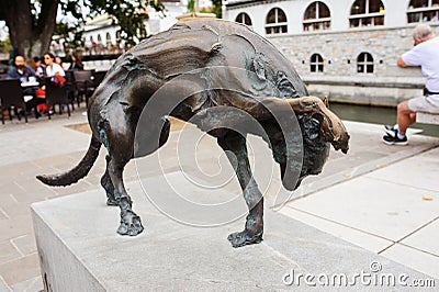 LJUBLJANA, SLOVENIA - AUGUST 15, 2017: Modern statue of dog by Jacov Brdar on Butcher Bridge Editorial Stock Photo