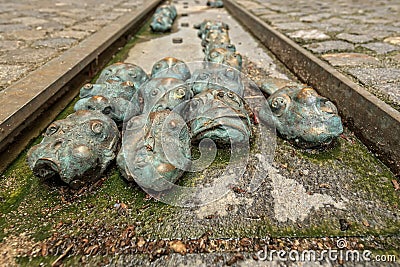 Old city centre - bronze sculptures of Faces Editorial Stock Photo