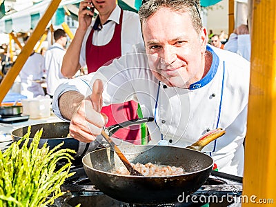 Ljubljana, Slovenia - May 6: Chef approving a dish at Open kitchen event, on May 6 2016 in Ljubljana, Slovenia. Editorial Stock Photo