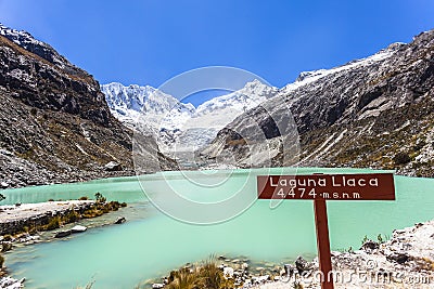 Llaca lagoon in the peruvian Andes and Ocshapalpa peak and Ranrapalca peak Stock Photo