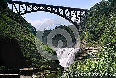 Llandscape photo of Upper waterfall in Letchworth State Park, State New York,USA. The bridge is over the waterfall Stock Photo