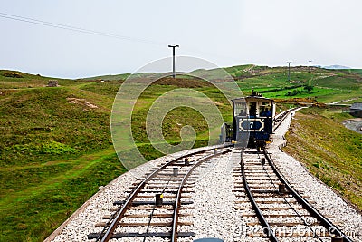LLandudno, Wales, North Shore Beach, UK - MAY 27, 2018 Old tramway getting on devided railway Tram choosing it s right way to rea Editorial Stock Photo