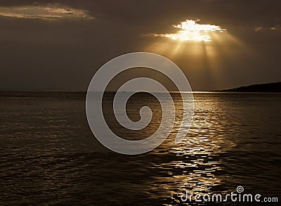 Llittle boat and Gods rays Stock Photo