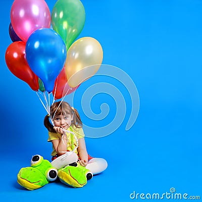 Llittle girl holding colorful balloons Stock Photo