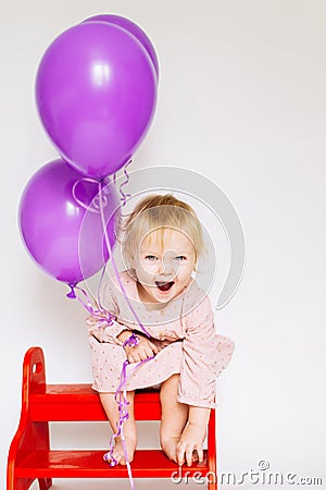 Llittle girl with pink balloon Stock Photo