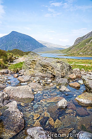 Llyn Idwal is a small lake that lies within Cwm Idwal in the Glyderau mountains of Snowdonia. Stock Photo