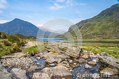 Llyn Idwal is a small lake that lies within Cwm Idwal in the Glyderau mountains of Snowdonia. Stock Photo