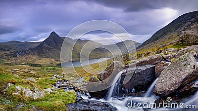 Tryfan in spring with the Afon Lloer in flow over the waterfalls, Wales Stock Photo