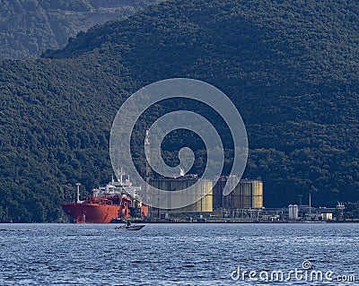 LNG carrier for the transport of liquid methane gas docked in a regasification plant in La Spezia Stock Photo