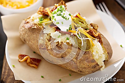 Loaded baked potato with bacon and cheese Stock Photo