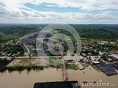 Loading coal onto the barge from the stock pile, aerial view Editorial Stock Photo