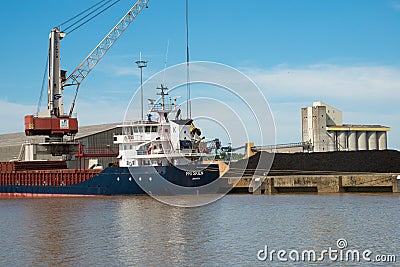 Loading coke in a nautical vessel at Bordeaux port Editorial Stock Photo