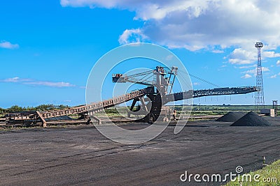 Loading iron ore conveyor machine in steel industry Stock Photo