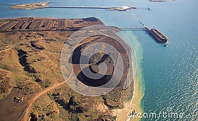 Loading iron Ore on a ship. Stock Photo