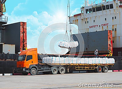 Loading refine sugar in jumbo bag into vessel hold. Cargo delivery and shipping Stock Photo