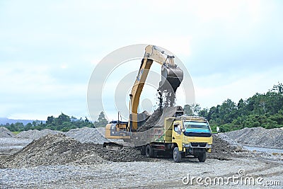 Loading truck with sand by excavator Editorial Stock Photo