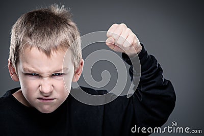 Loads of aggression in a little boy Stock Photo