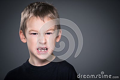 Loads of aggression in a little boy Stock Photo