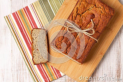 Loaf Of Banana Bread On Cutting Board Stock Photo