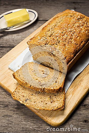 Loaf of Banana Bread on Wooden Table Stock Photo