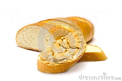 A loaf of bread and a sandwich piece of bread with peanut paste Stock Photo