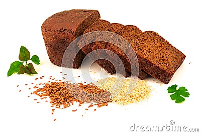Loaf of sliced dark brown black bread with flax, sesame seeds and green leaves isolated on white background Stock Photo